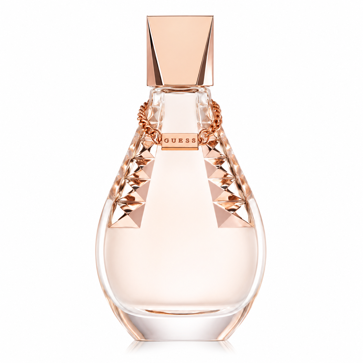 Guess perfume bottle for women isolated on a white background, featuring a teardrop-shaped clear glass bottle with blush pink fragrance, faceted crystal accents, a rose gold cap, and a decorative chain around the neck.