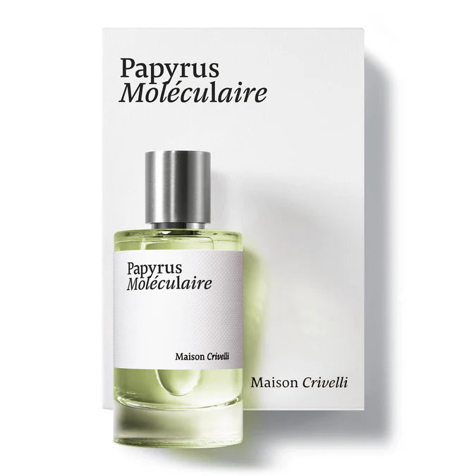 A 100ml cylindrical glass bottle of Maison Crivelli Papyrus Moléculaire Eau De Parfum with a brushed silver cap, standing in front of its clean, oversized white presentation box featuring elegant black serif typography.