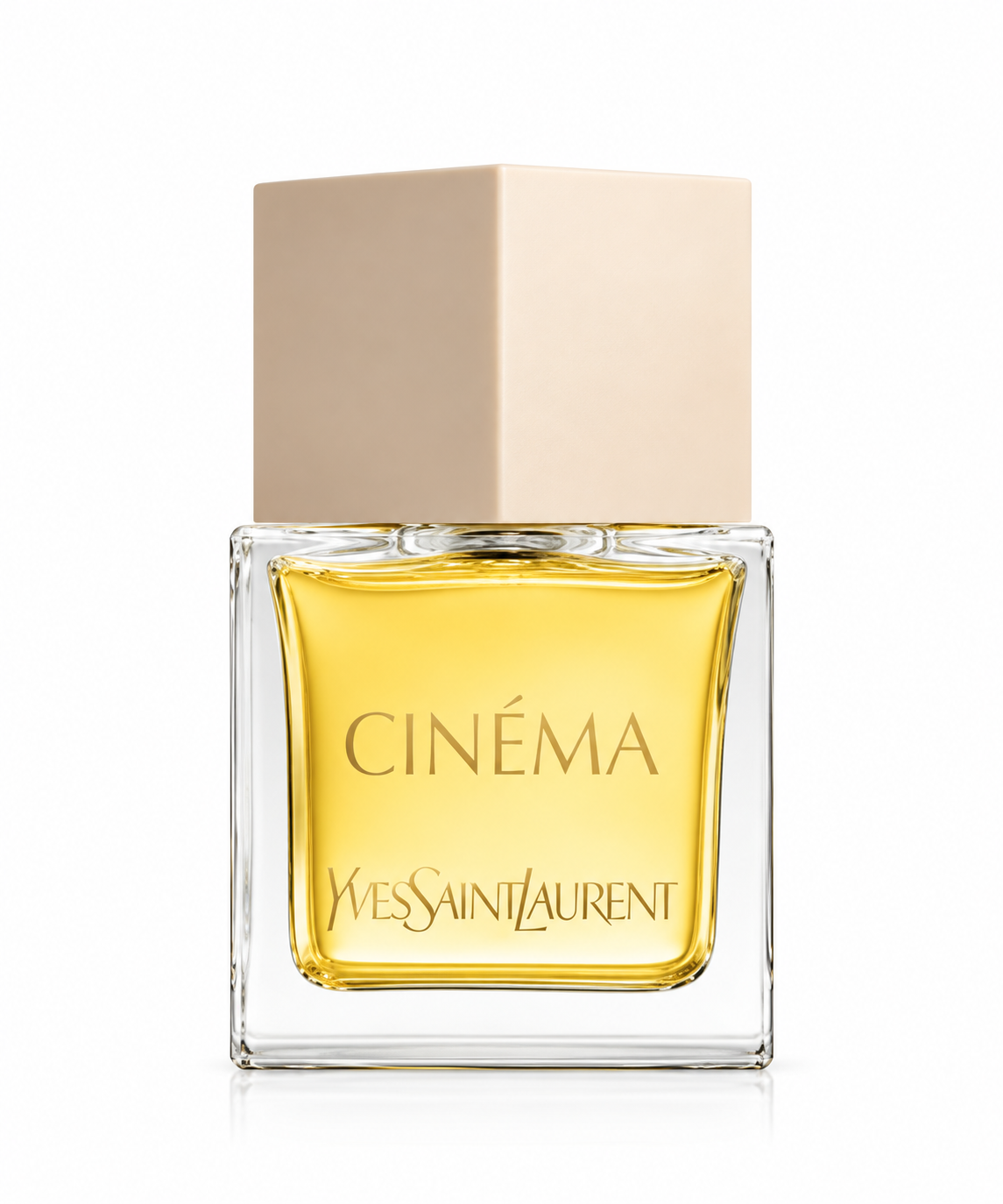 Yves Saint Laurent Cinéma 80ml EDP for Women presented in its elegant square transparent glass bottle filled with warm golden fragrance, featuring refined gold Cinéma and Yves Saint Laurent branding and a soft nude-beige geometric cap, photographed against a clean pure white background.